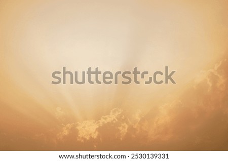 Dramatic orange sky with sunlit clouds creates ethereal abstract background. Tranquil beauty of sunset for inspirational imagery. Spiritual and nature-themed designs. Ideal for meditation apps.