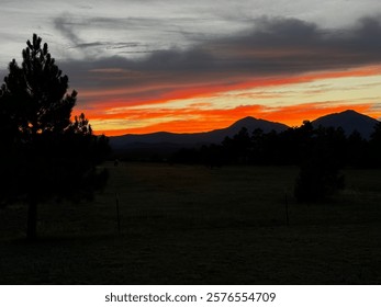 dramatic orange sunset over the mountains