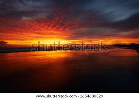 Dramatic orange sunset over Nosara peninsula, Costa Rica