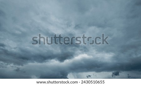 Dramatic overcast sky with dark storm clouds, ideal for background with copy space for text or weather related concepts