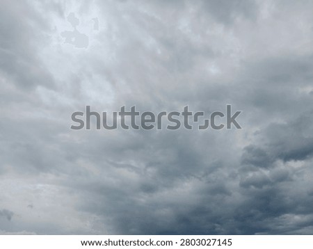 Dramatic overcast sky with dense storm clouds, ideal as a background for weather concepts, presentations, design projects, and atmospheric visual storytelling.