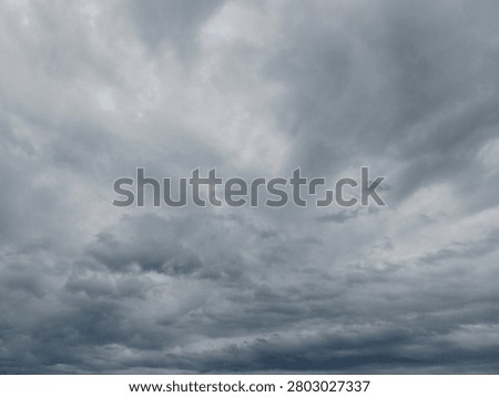 Dramatic overcast sky with dense storm clouds, ideal as a background for weather concepts, presentations, design projects, and atmospheric visual storytelling.