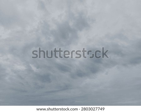 Dramatic overcast sky with dense storm clouds, ideal as a background for weather concepts, presentations, design projects, and atmospheric visual storytelling.
