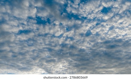 Dramatic overcast sky with dense white and grey cloud coverage over tropical landscape 