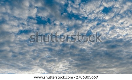Dramatic overcast sky with dense white and grey cloud coverage over tropical landscape 