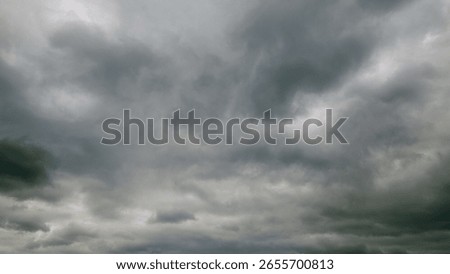 A Dramatic Overcast Sky Filled with Dense Grey Clouds, Perfect for Artistic Inspirations