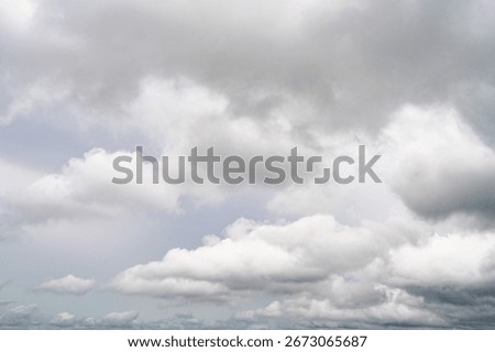 Dramatic overcast sky with gray and white clouds before rainy season storm, moody and gloomy weather background. Climate, meteorology, and atmospheric. Weather forecasting, climate change background.