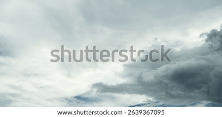 Dramatic overcast sky panorama with gray storm clouds during rainy season. Moody atmospheric background perfect for weather forecasting and emotional storytelling. Climate change awareness.
