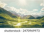 Dramatic panoramic landscape view of the mountains, river and cloudy sky with sun flare in the sky. Truso valley. Kazbegi. Travel in Georgia