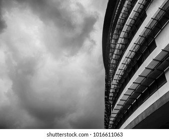 Dramatic perspective architectural black and white. Abstraction of curves metal grill  protection for education building. 