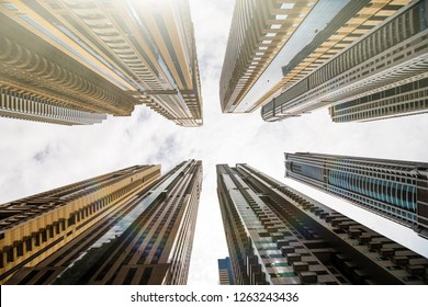 Dramatic Perspective With Low Angle View Of Skyscrapers Looking Up To The Sky, Dubai. Vanishing Point