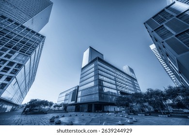 Dramatic Perspective of Urban Architecture Under Clear Blue Sky  