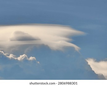 Dramatic Pileus Cloud Formation Casting a Shadow Over a Cumulus Tower