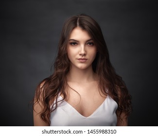 Dramatic Portrait Of A Beautiful Girl On A Dark Background