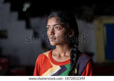 Dramatic portrait of an indian young girl in lowkey