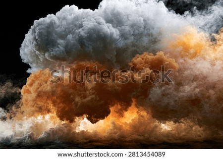 A dramatic and powerful explosion depicted by a massive cloud of dark smoke and fiery orange hues against a black background.