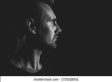 Dramatic Profile Portrait Of Male Person On Dark Background