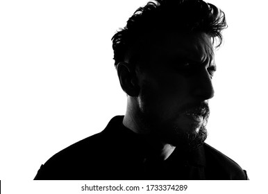 Dramatic Profile Portrait Of Male Person Over White