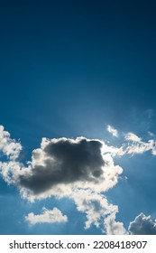 Dramatic Puffy White Clouds In The Blue Sky, Sun Cover Behind The Clouds, Summed Day, No People..