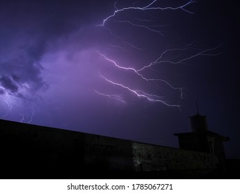 Dramatic Purple Lightning Strike Amidst Of Thunderstorm During Midnight In Delhi, India. Dramatic Sky. 