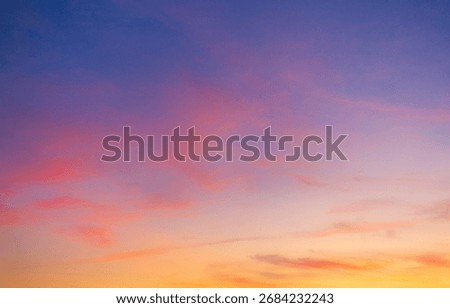 Dramatic purple and orange clouds fill the sky during either sunrise or sunset.
