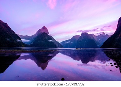 Dramatic purple and pink skies at Milford Sound as the dawn breaks