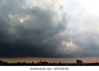 Dramatic rain cloud background pattern over city.