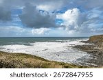 Dramatic rain clouds gathering at Widemouth Bay at North West Cornwall 