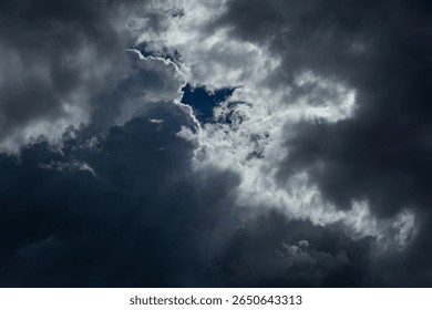 Dramatic rain clouds with sun rays, abstract weather backdrop