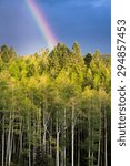 Dramatic rainbow over Santa Fe Ski Basin highlighting vivid fall colors