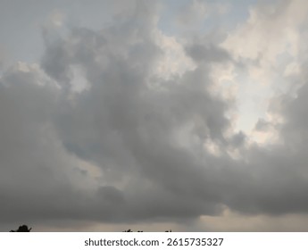 Dramatic rainy clouds float in the peaceful evening skly
