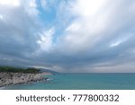 Dramatic rainy sky and clouds over sea in Greece