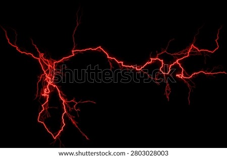 Dramatic red electrical lightning strike glowing against a deep black background, representing power, energy, and intensity.