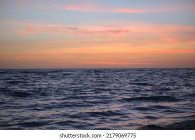 Dramatic Red Ocean Waves At Sunset With Soft Evening Sea Dark Water