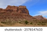 dramatic red rock formations   on a sunny winter day   in the san rafael river canyon along the buckhorn draw scenic byway in the northern san rafael swell near green river,  utah 