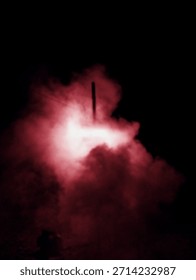 Dramatic Red Smoke Cloud – Illuminated Pyro Effect Against Dark Background with Vertical Element
