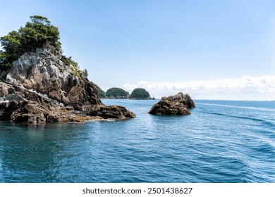 Dramatic rock formations on the coast of Pacific Ocean in Nachikatsuura, Wakayama, Japan, part of the Yoshino-Kumano National Park and Nanki Kumano geopark. - Powered by Shutterstock