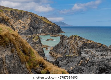 Dramatic rocky cliffs and Atlantic waters below the coastal trail along the Galician shoreline. Pen Peles, Spain