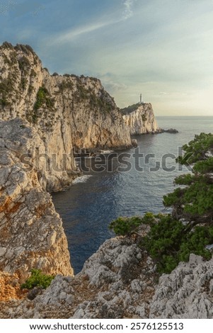 Similar – Image, Stock Photo Rocky cliff coast located in blue ocean in Italy