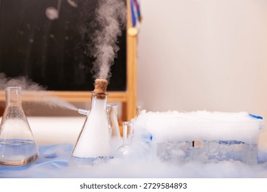 A dramatic science experiment with dry ice: fog billows from a laboratory flask, surrounded by glassware and a container of sublimating dry ice. Perfect for educational or lab-themed visuals