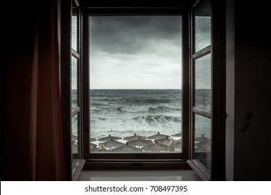 Dramatic Sea View From Opened Window With Big Stormy Waves And Dramatic Sky During Rain And Storm Weather In Fall Season On Sea Coast