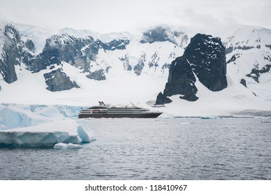 Dramatic Seascape In Antarctica, Cruise Ship In The Sea