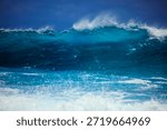 Dramatic seascape featuring powerful ocean waves crashing against rugged rocks and a rocky coastline. White foam and water splashes explode upon impact, creating a dynamic and awe-inspiring scene. The rough sea under a moody sky captures the raw energy and untamed beauty of nature. Perfect for themes of power, force, nature