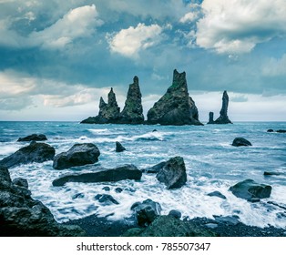 Dramatic seascape of Reynisdrangar cliffs in the Atlantic ocean. Fantastic summer morning on south Iceland, Vik village location, Europe. Instagram filter toned.