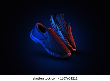 Dramatic shoe pair with blue and red light on dark background