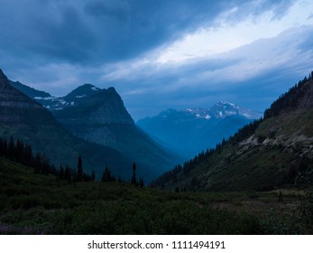 Dramatic sky above a dark mountain range at dusk