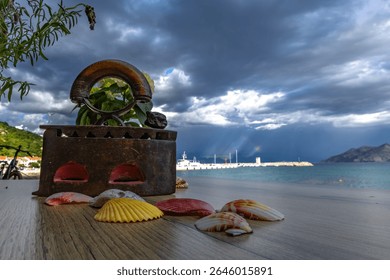 Dramatic sky after a storm, clouds over the Velebit Mountains in Croatia, a colorful rainbow breaks through the dark rain clouds