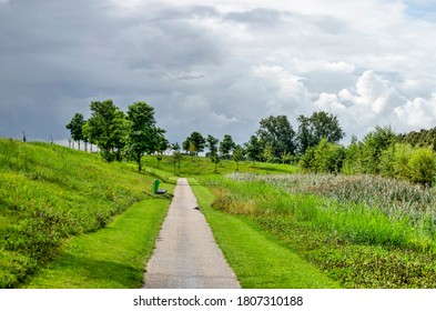 Dramatic Sky With Approaching Rain Clouds Over A Footpath In The New Annie M.G. Schmidt Park In Berkel En Rodenrijs, The Netherlands