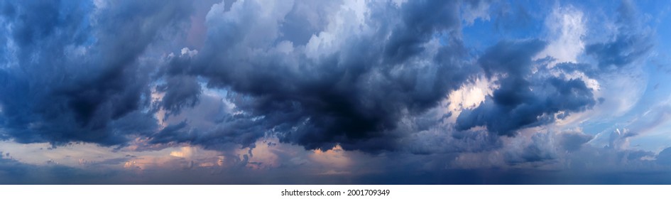 Dramatic sky background with dark rainy clouds at sunset. - Powered by Shutterstock