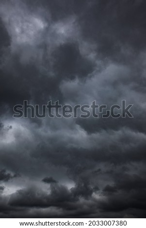 Dramatic sky with black stormy clouds, may be used as background